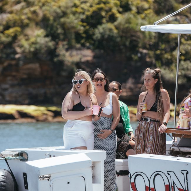 A group of women enjoying a luxury yacht hire on Sydney Harbour.