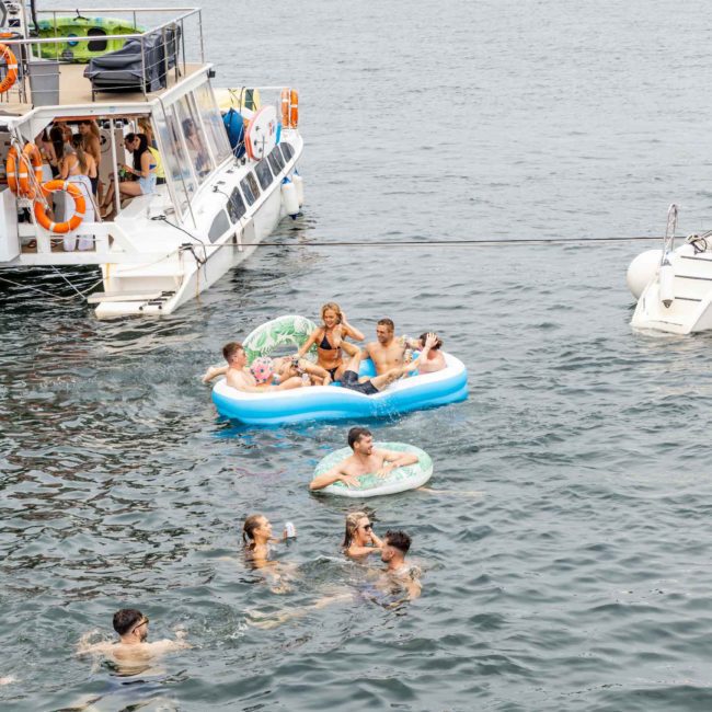 A group of people enjoying a Corporate boat event in Sydney Harbour.