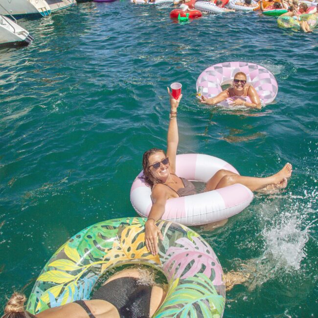 A group of people floating in water.